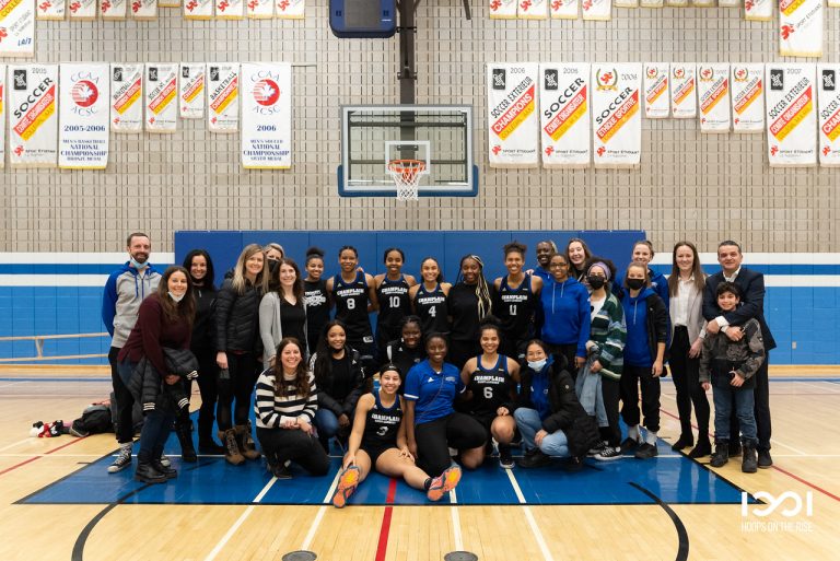Women's Basketball team with coaching staff.